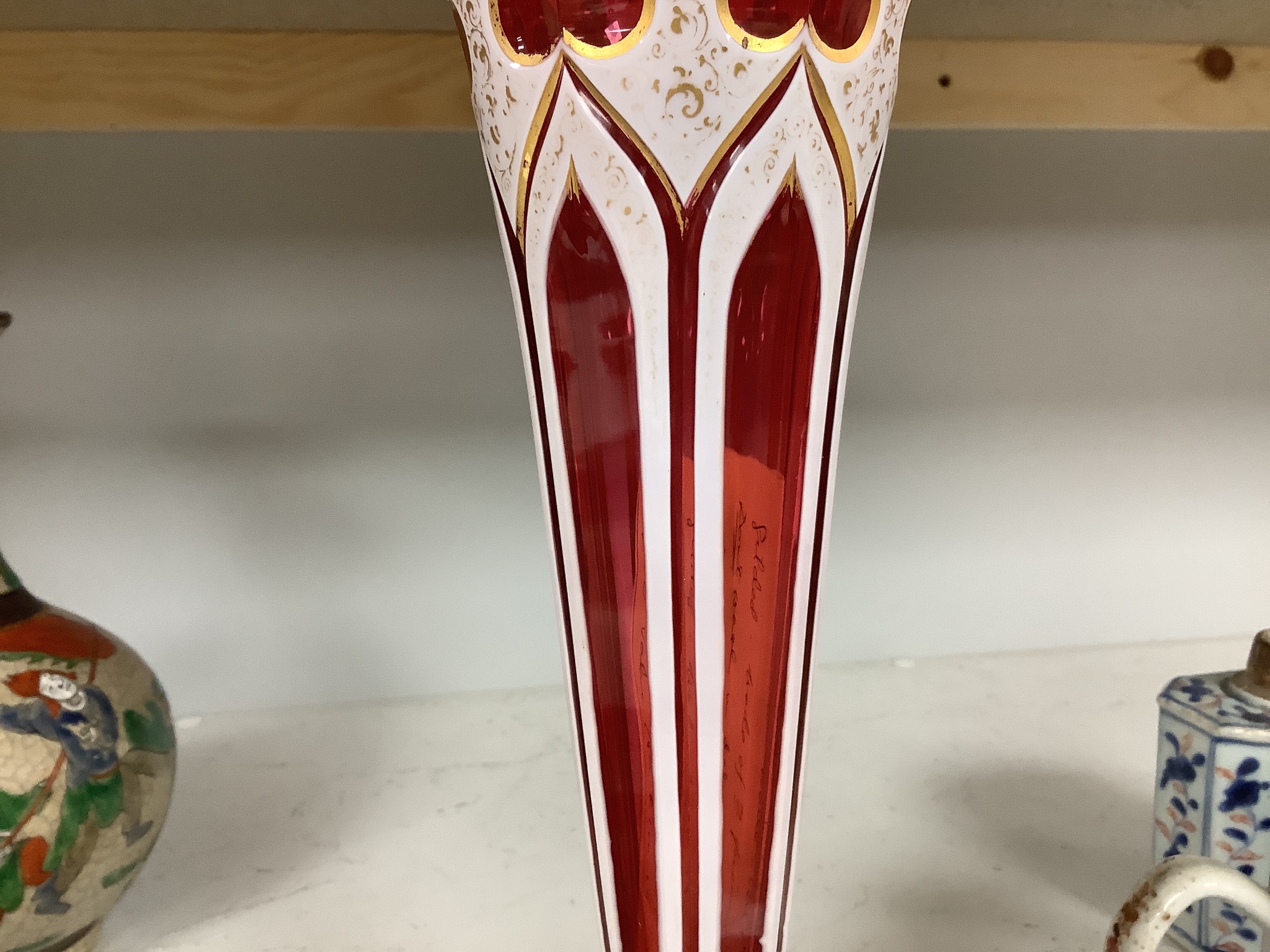 A Bohemian overlaid ruby glass vase, 31cm